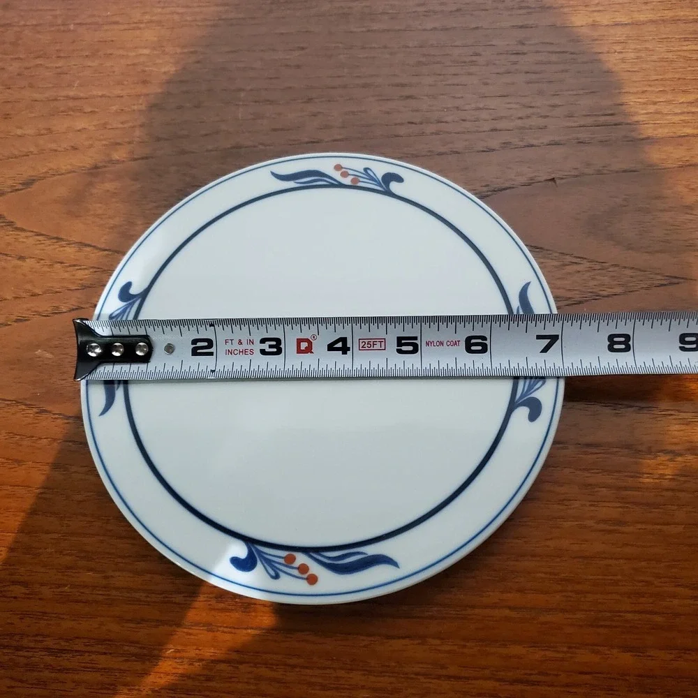 Dansk Bistro Maribo pattern porcelain trivet blue leaves and red berries‎